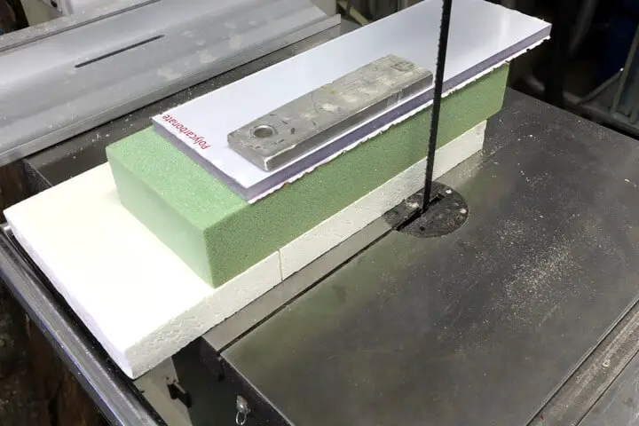 Plastic foams, plexiglass and aluminium cut with a band saw