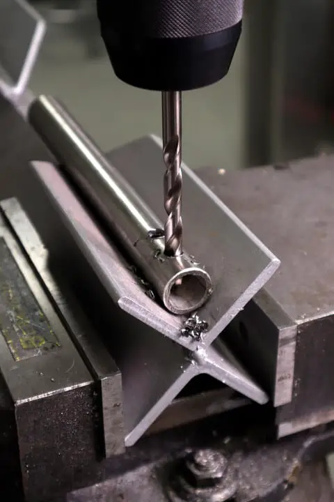 Drilling stainless steel pipe in the drill press using a V holder